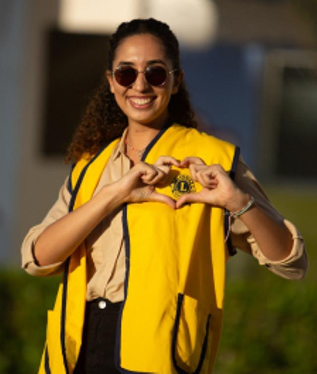 lion making heart shape with hands